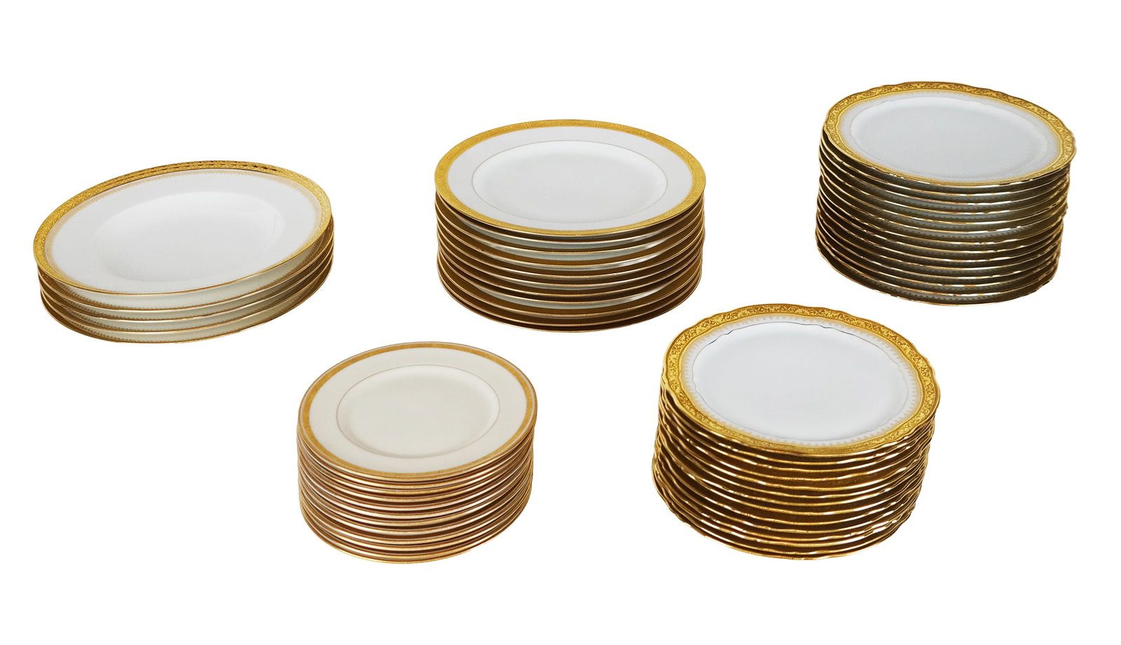 Limoges & Others Gilt Decorated Plates, 56: Limoges & others gilt decorated plates, 20th century, 56 total, including: 14 Limoges veritable encrustation gilt decorated salad plates, marked to base with "Limoges France" and makers marks; 14 Limo