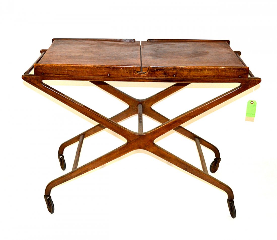 Danish Modern Cart: Danish modern service cart, having two hinged lift-out leaves on an x-stretcher-form base, (castors). [41" L x 18" D x 29 1/2" H; Leaves: 17" L]