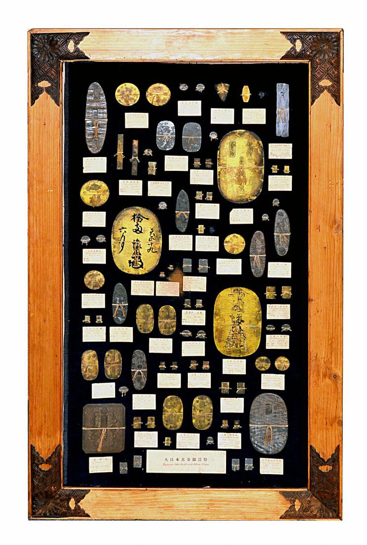 Vintage Japanese Display of Replica Antique Coins: Features 70+ species all mounted together on a black mount and framed. As is, few missing pieces and loose mounting board. [Frame: 40 1/2" x 24 12"]