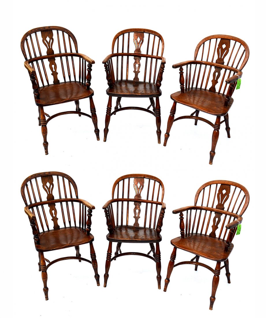 Set of Six Oak Windsor Chairs: Barrel-back oak armchairs with pierced tulip-motif backsplats. [19 1/4" W x 15" x 36 1/4"]