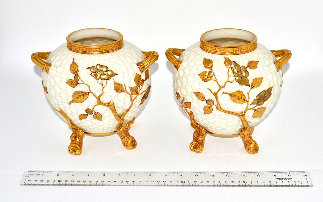 Pair of Royal Worcester Parcel Gilt Vase: Asian-inspired vases on gilt twig-form feet with leafy flower blossoms above. In good condition. [8 1/2" W x 6" D x 8" H]