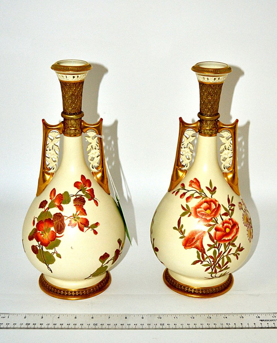 Pair of Royal Worcester Persian-Style Vases: Parcel gilt hand-painted bulb form vases with floral decor and pierced mouth and handles. Light wear. Both marked on bottom. [Each: 6 1/2" Dia x 14 1/2" H]