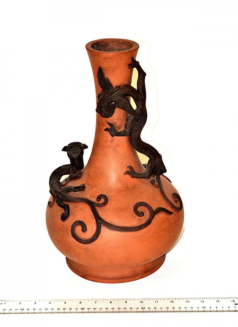 Earthenware Vase with Applied Dragon Decor: Bulb-form vase bearing two stylized dragons and scrolling tendril accents. Some scuffs, otherwise complete. [9 1/2" Dia x 15 1/2" H]