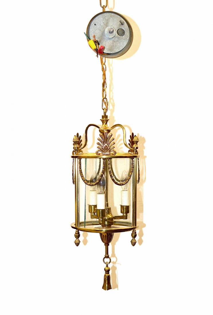 Three Light French Lantern: Three light garland decorated with a tassle finial from The Palace Hotel, NYC. [21" H x 8" Dia (approx)]