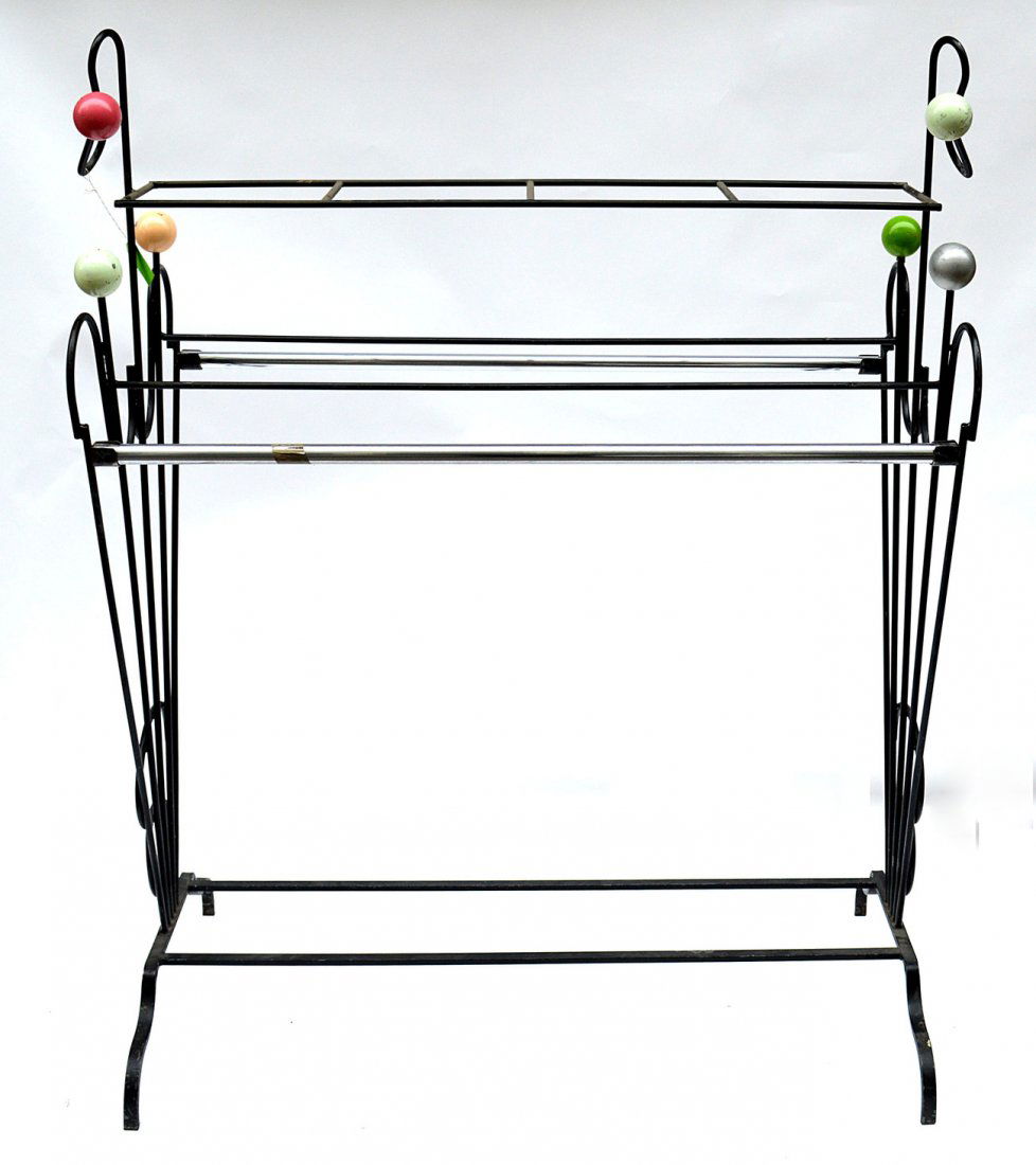 Modern Garment Rack: Double-sided rack with flaring ends and multi-colored 3" Dia ball finials. Paint chips, otherwise structurally sound. [58" W x 29" D x 71" H]