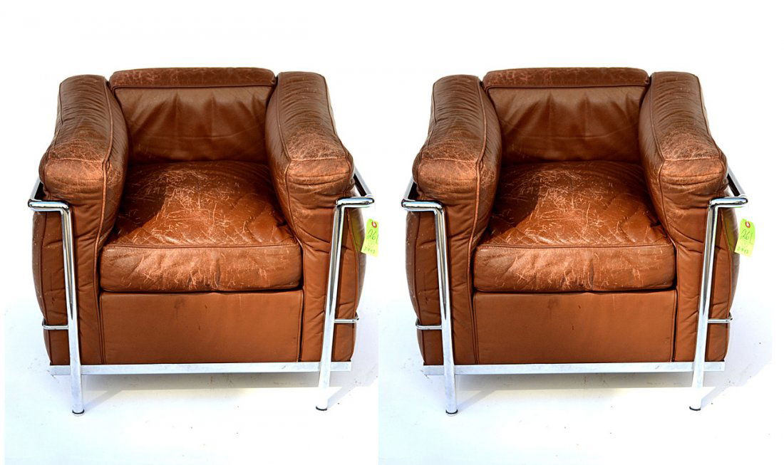 Pair Le Corbusier Club Chairs: Pair of Le Corbusier club chairs by Atelier International Limited - Manufactured under license by Cassina. Very worn. [30" x 27 1/2" x 26 1/2" H]