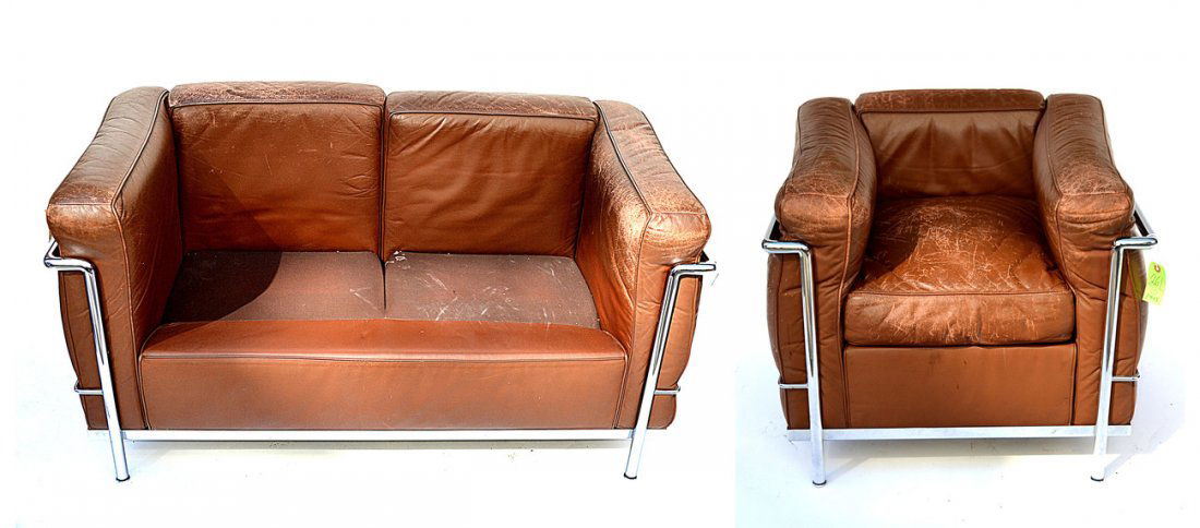 Le Corbusier Settee and Club Chair: Le Corbusier settee and club chair, missing two cushions. By Atelier International Limited, manufactured under license by Cassina. Sofa missing two cushions, very worn. [Sofa: 51" L x 27 1/2"D 26 1/2"