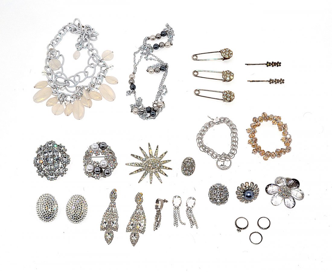 Silver-Tone Costume Jewelry: Includes silver-tone rhinestone and paste stones: pins, earrings, rings, bracelets, and necklaces.