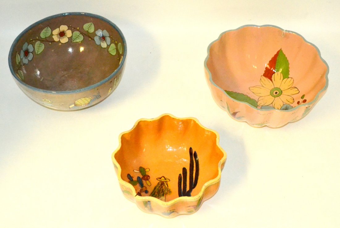 Vintage Mexican Glazed Earthenware Bowls [3]: Comprises: 1.) Bowl with running deer, figure with sombrero and donkey, and stylized cacti. [12" Dia x 6 1/4" H]. 2.) Scalloped bowl with sombrero figure decor. [10" Dia x 4 3/4" H]. 3.) Scalloped bow