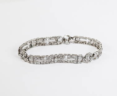 Art Deco Diamond and Platinum Bracelet: Art deco diamond and platinum flexible bracelet, with millegraining, set with 3 marquise-cut, 6 baguette-cut, and 168 round (single and full-cut diamonds, total approximately 6.00 carats, 14.5 dwt. [7