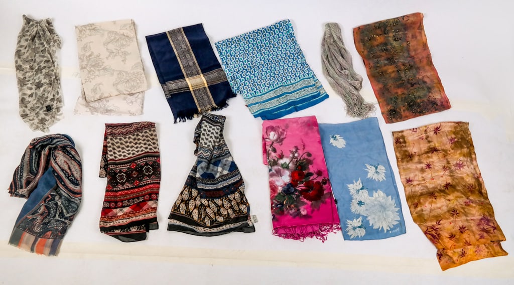 Silk and Other Vintage Scarves, 11: Group of 11 silk and other scarves comprising a Donna Lynn Friedson hand-painted pink silk scarf, a Vera blue silk scarf with flower decoration, a QY Feel printed silk scarf with knit backing and frin