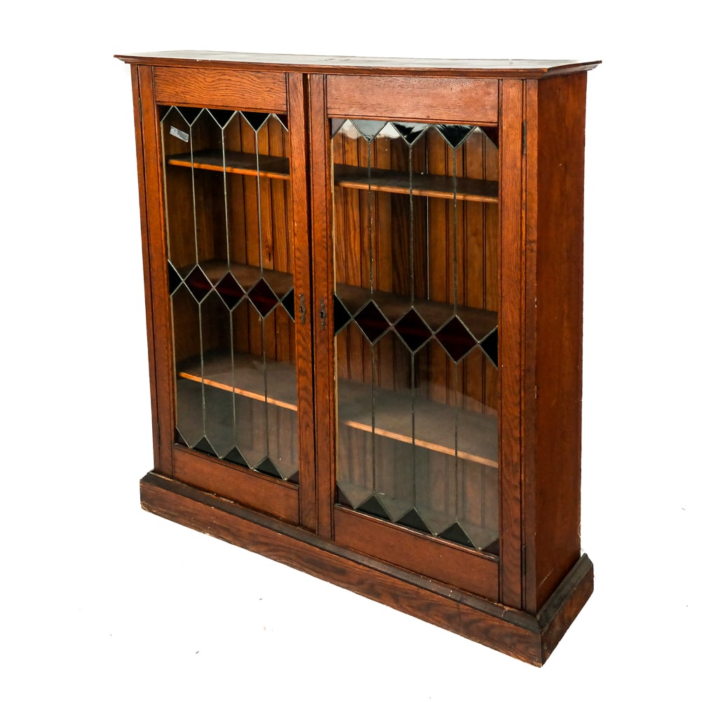 Victorian Oak and Leaded Stained Glass Bookcase: Victorian oak and leaded stained glass bookcase, late 19th century, with 3 adjustable shelves and beadboard back [45" H x 41" W x 10.25" D]. Overall condition is good/fair, with some separations and w
