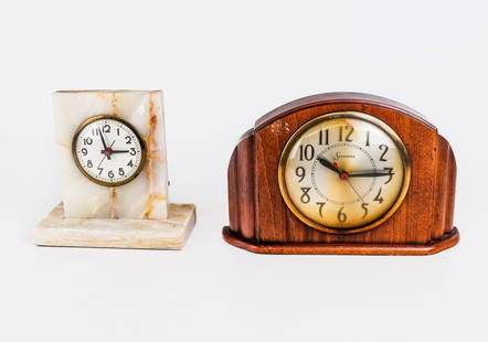 Two Antique Mantle Clocks: Two antique mantle clocks, early 20th century, comprising a Sessions mahogany clock and a Gilbert white onyx clock on base, each with marks to faces. [Larger: 7" H x 11.25" W x 2.75" D]. Overall condi