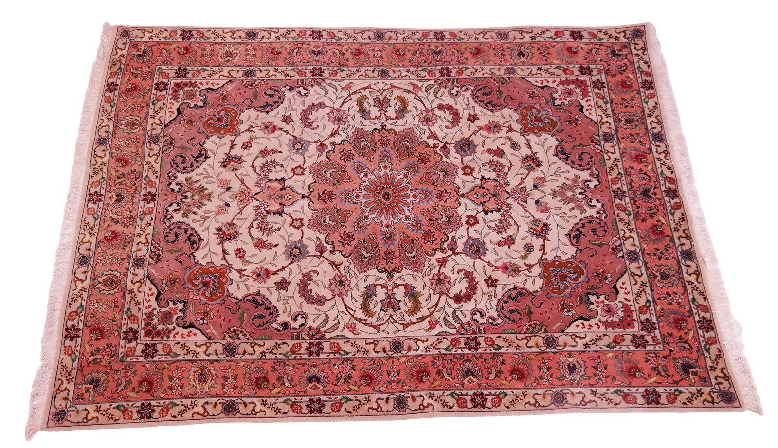 Oriental Rug: Oriental rug in pink and tan with sunburst-style medallion center and corner spandrels, with guarded border. [4' 10" x 7']. Stiff but not dry.