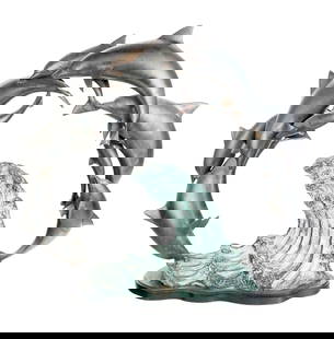 Sculpture of a Pod of Dolphins Over a Wave