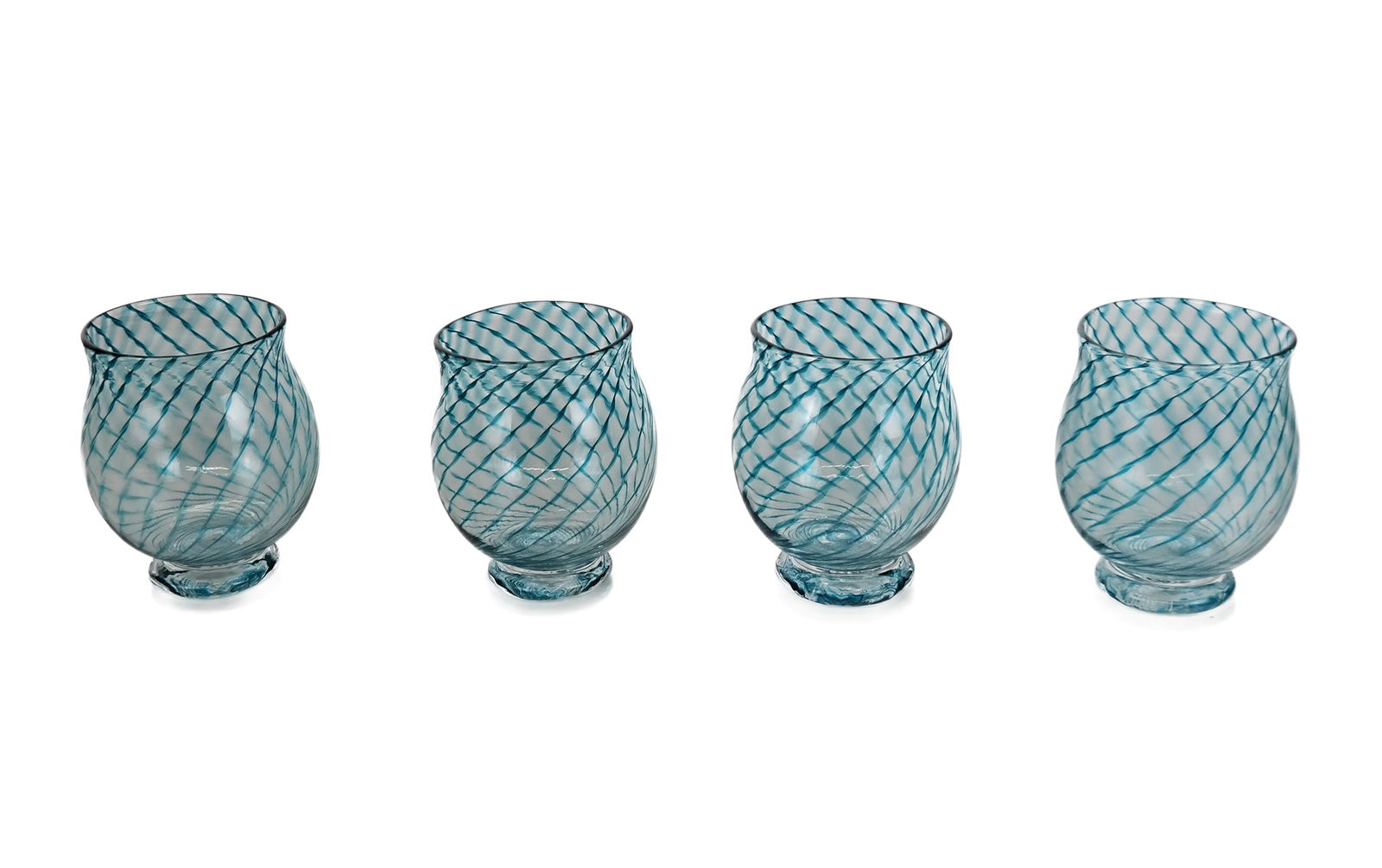 Four Hand Blown Art Glass Cups: Four art glass hand blown cups with dark turquoise caned swirls, signed and dated to base ?Zieske. [4.25" H x 3.5" Diameter]. Overall condition is good, one with minor scratches to base.