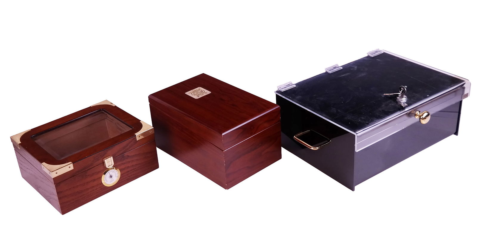 Three Assorted Humidors: Three assorted humidors comprising Royal 21 Salute humidor, Quality Traditum humidor, and a Dancraft acrylic humidor, marked. [Largest: 6.25" H x 16.25" W x 11.5" D]. Overall condition varies: Royal 2