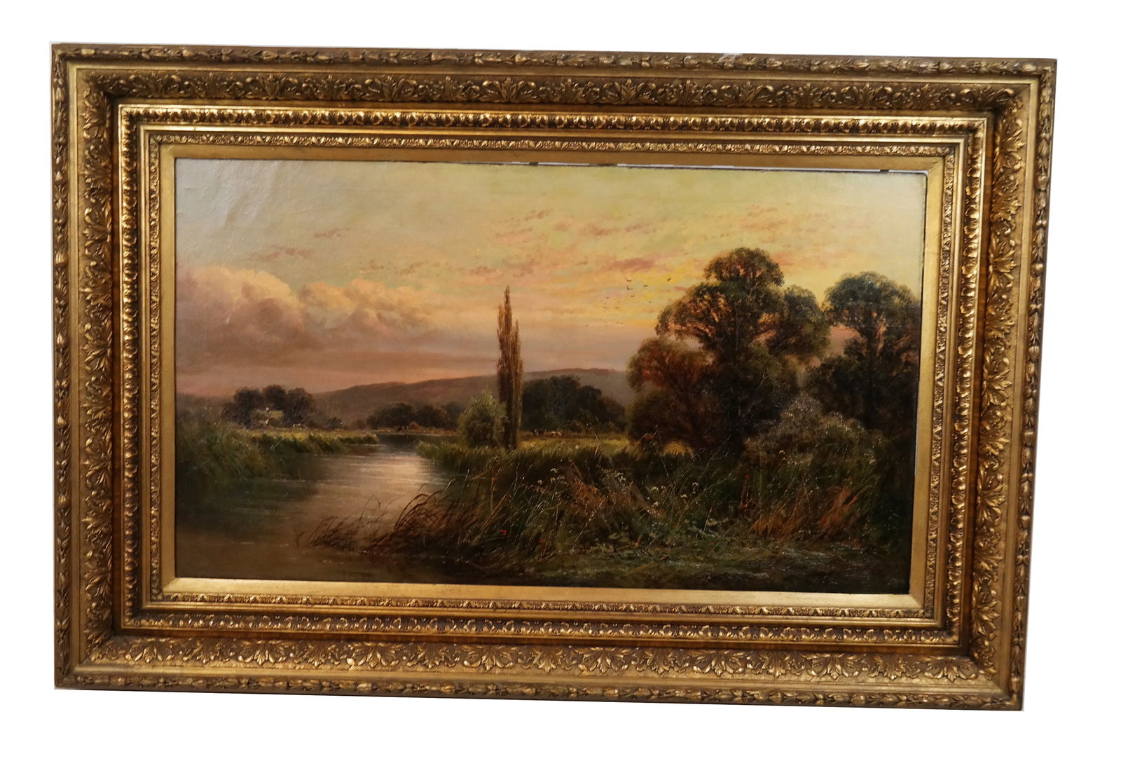 Sunset In Country Landscape - Oil Painting: Oil on masonite painting of a sunset in a country landscape with a lake, cows and trees, signed illegibly lower left. [Art: 24" H x 42" W; Frame: 36" H x 54" W].