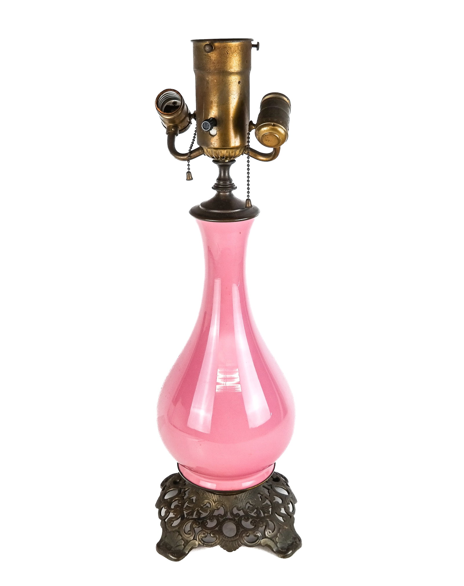 Victorian Pink Glass Lamp: Victorian pink glass baluster from lamp with pierced metal base, 20th century, with fitting for a glass shade. [24" H x 10" Diameter]. Overall condition is fair, requires wiring.