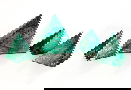 Four Malachite Pyramids: Four mosaic malachite pyramids, larger with inset brass bands. [Largest: 7" H x 6.5" Square]. Condition is good with scattered minor losses.
