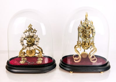 Two Brass Skeleton Clocks in Glass Cases