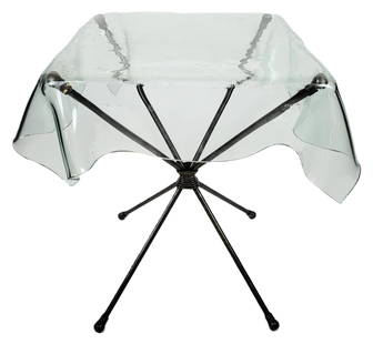 Contemporary Glass Top Side Table: Modern glass top and wrought iron side table, 20th/21st century, with a handkerchief glass top over a wrought iron base with four legs, marked JTS to legs. [26.25" H x 28" Square]. Condition is good w