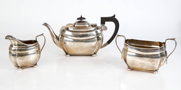 English Silver Tea Set, 3: English silver assembled three piece tea set, comprising a teapot with wood handle and finial, Chester, 1927, by S Blanckensee & Son Ltd, and creamer and sugar, Birmingham, 1927, by S Blanckensee & So