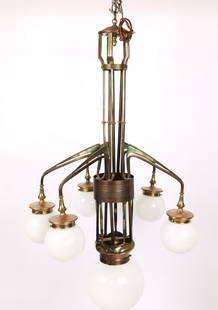 Art Nouveau Patinated Brass Chandelier: Art Nouveau patinated brass chandelier, 19th/early 20th century, with an extended column and five affixed arms terminating in milk glass shades, around a central light milk glass shade. [45" H x 26" D