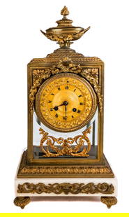 Louis XVI Bronze Dore Mounted Mantel Clock: Louis XVI bronze dore mounted mantel clock, 19th century, possibly Baccarat, with a flame and urn form finial, with a bronze mounted case, with swags, over a gilt face, and beveled glass to each side,