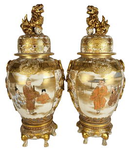 Complimentary Pair Japanese Palatial Satsuma Urns: Complimentary pair Japanese palatial satsuma urns, 19th/20th century, with food dog finials to lids, over heavy gilt and moriage decoration, thunder patten to lip, over further decorated bodies with t
