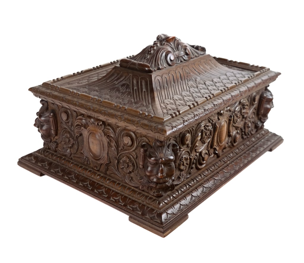 Three boxes and a Humidor: Four boxes comprising two heavily carved and lined jewelry boxes, a diminutive carved casket box on feet, and an enamel and metal lined humidor. [Humidor: 5.25" H x 11" W x 8" D]. Condition is good wi