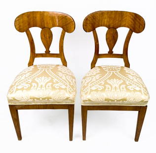 Pair of Fruitwood and Upholstered Side Chairs: Pair of fruitwood and upholstered side chairs, 20th century, with shield backs and decorated upholstery. [35.5" H x 19" W x 20" D; seat height: 20"]. Condition is good to fair with lifting and scatter