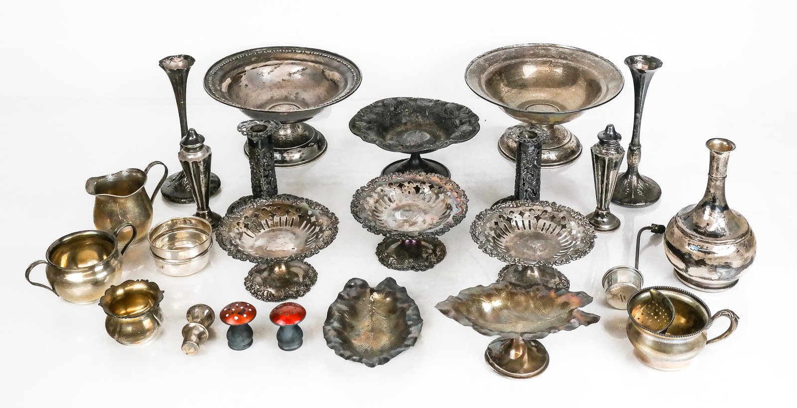 Group of Assorted Silver Items, 20+: Group of assorted silver items comprising set of 3 sterling silver reticulated tazzas, sterling silver strawberry decorated tazza, set of 2 sterling silver leaf form candy dishes, 2 sterling silver co