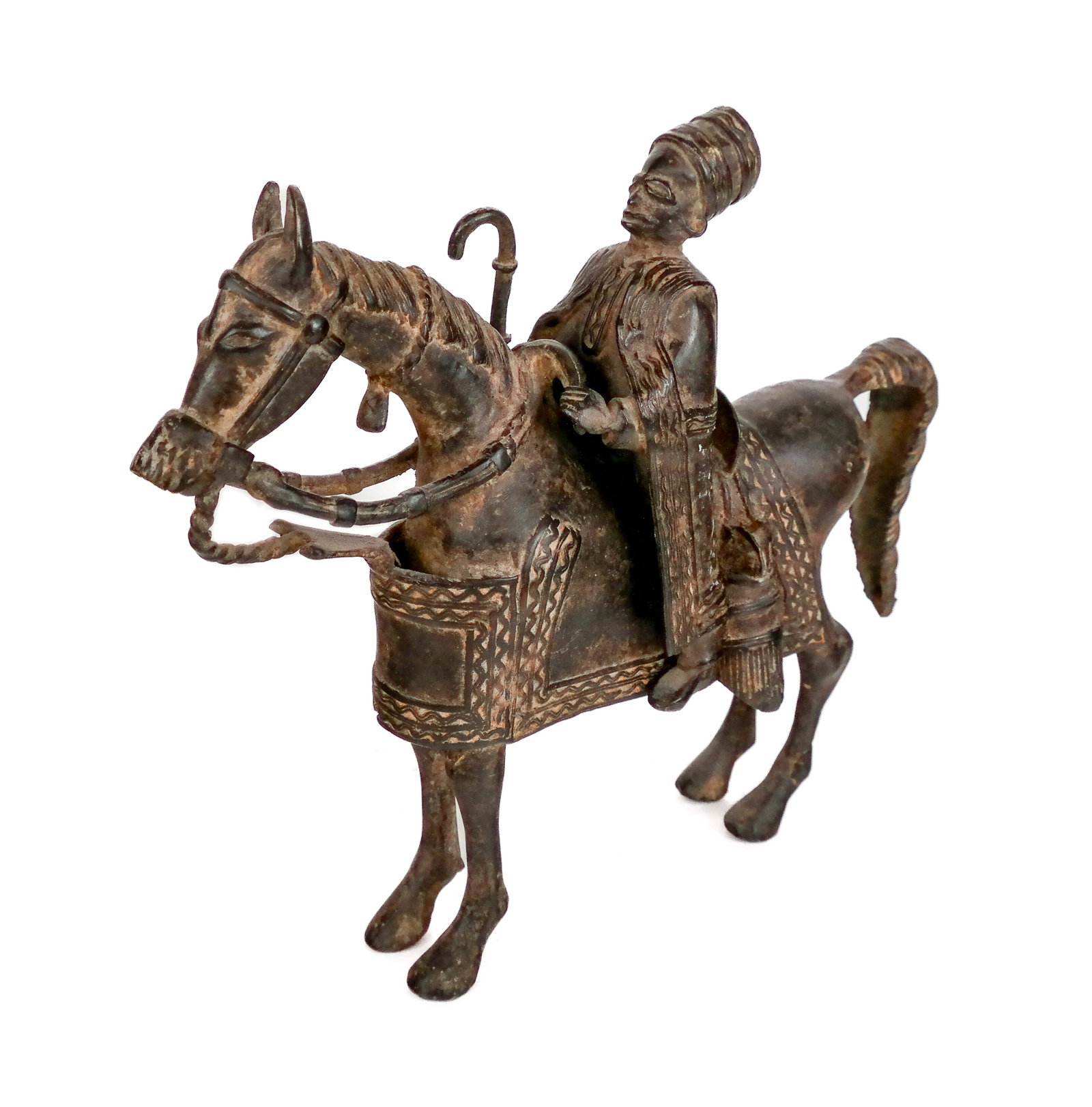 South Asian Bronze of a Rider: South Asian, likely south Indian, bronze figure of a semi-affixed rider on a horse. [11.25" H x 3" W x 12" D]. Condition is good. From the Estate of Ronald Blatt, owner of Blatt Billiards, in New York