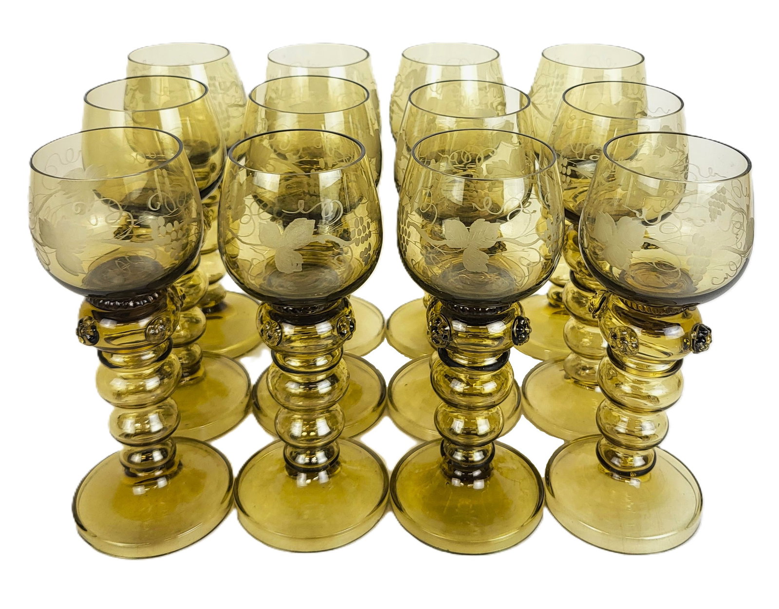 12 Roemer Rhine Etched & Beehive Stem Wine Glasses: 12 Roemer Rhine wine glasses, late 20th century, 11 with grape and wine etched cups, one unetched, over beehive and decorated stems. [7.5" H x 3" Diameter]. Condition to each is good with fleabites an