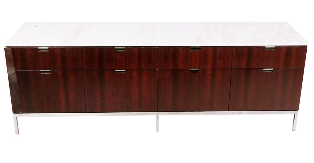Florence Knoll Rosewood and Marble-Top Credenza: Florence Knoll rosewood and marble top credenza, third quarter of the 20th century, with four drawers above four filing drawers, resting on a chrome base, unsigned. [25.5" H x 74.75" W x 18" D]. Overa
