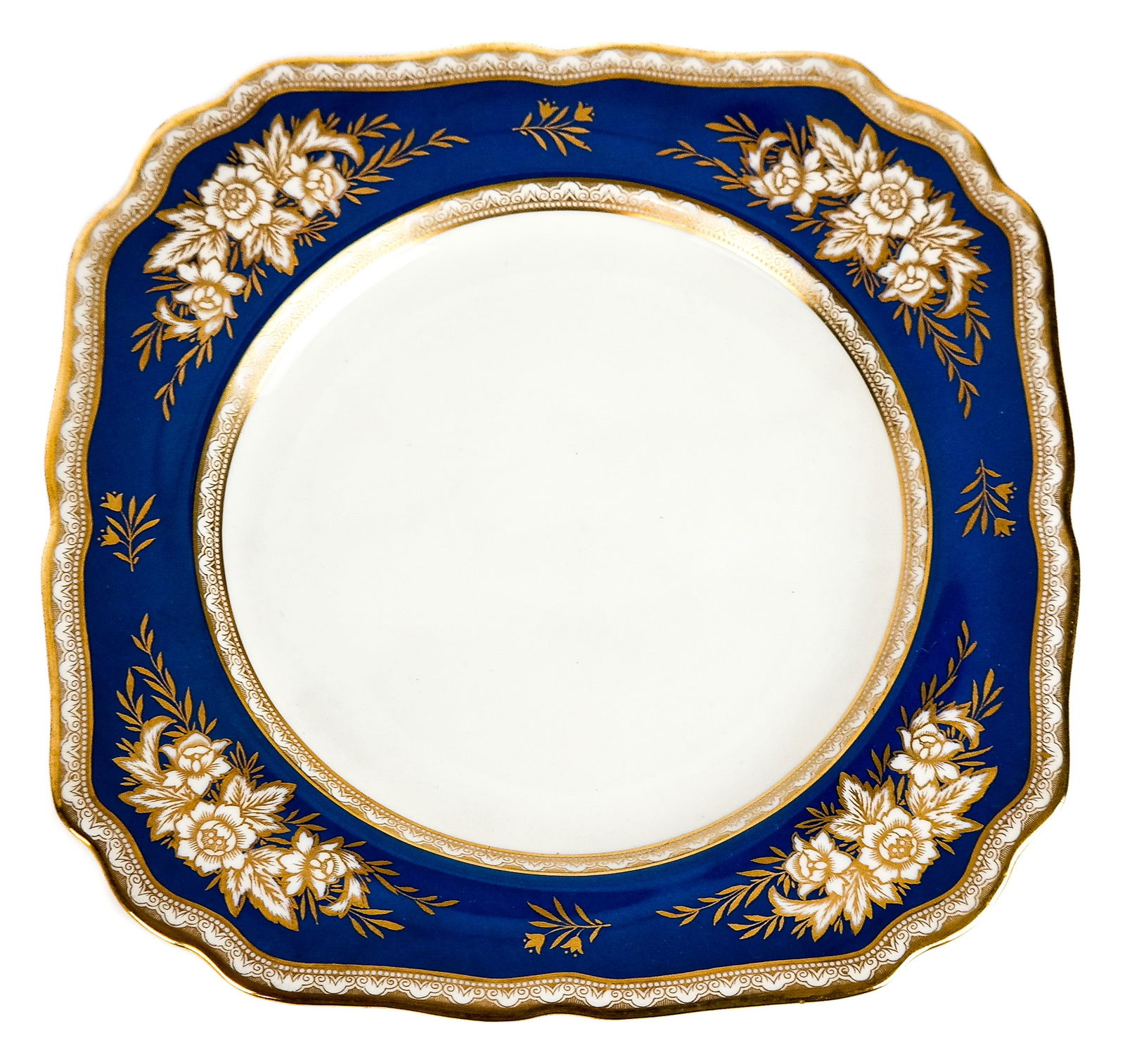 Mintons Blue, Gilt and Cream Dessert Plates, 18: Mintons retailed by Tiffany & Co., England, 1873-1912, of squared outline, the cream and gilt rim enclosing a blue border with gilt decorated flowers and enclosing a cream center, marks to reverse. [8
