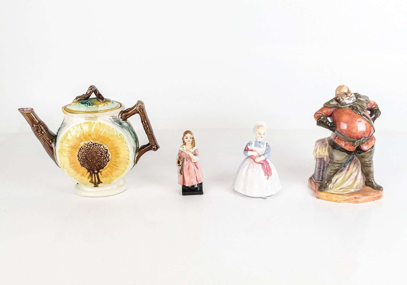 Royal Doulton and Other Porcelain, 4: Royal Doulton and other porcelain objects, 20th century, comprising a Doulton England "Little Nell" figurine, a Royal Doulton "The Rag Doll" Figurine, a Royal Doulton Fallstaff figurine, and a porcela