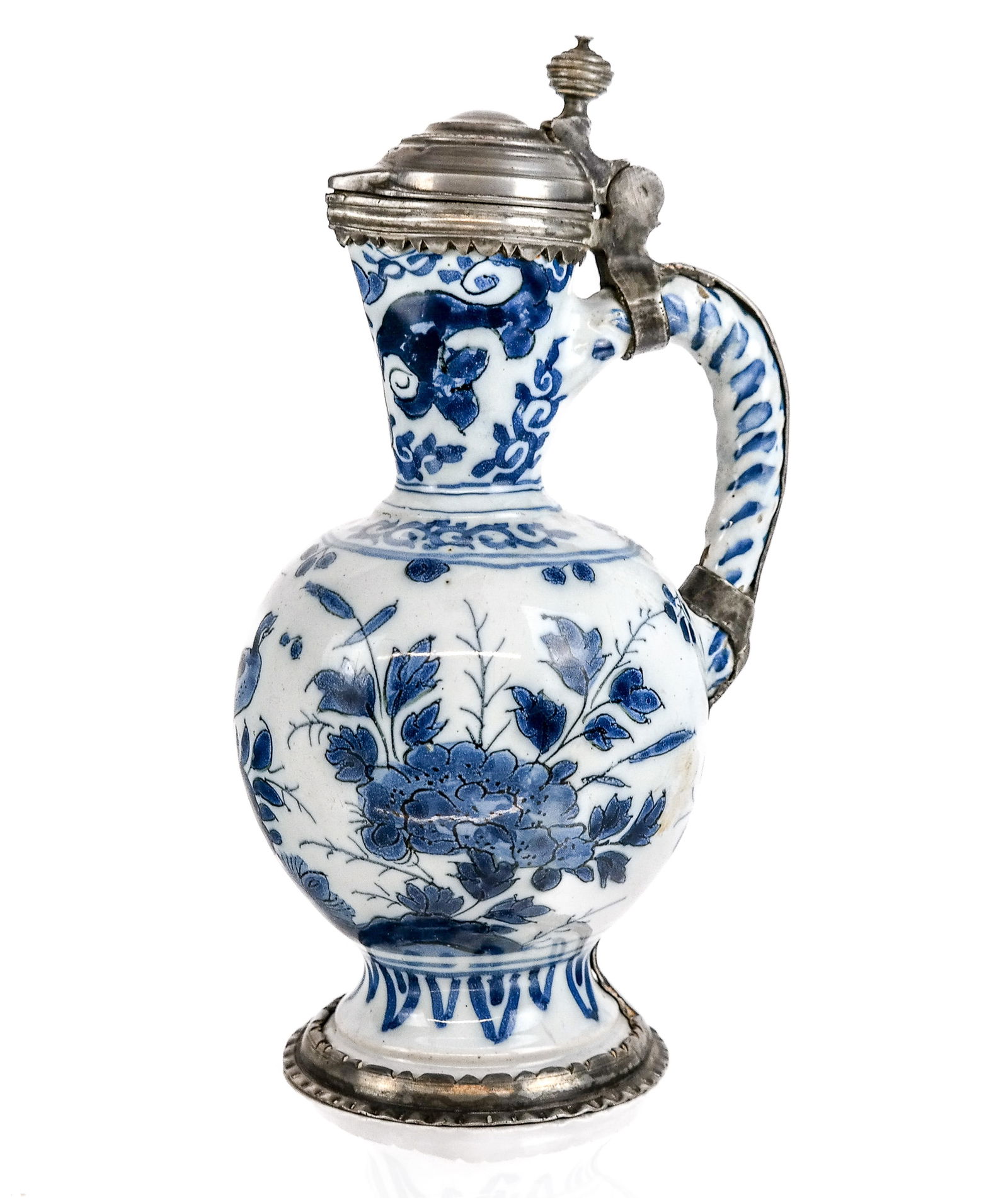 Pewter Mounted Delftware Ewer: Pewter mounted Delftware ewer, 18th/19th century, with hand-painted decoration and marked to base. [10" H x 6" W x 5" D]. Condition is good with wear commensurate with age. Estate of Jacqueline Yudelo