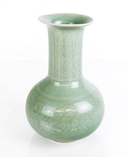 Chinese Celedon Vase: Chinese celadon vase, 19th century, with an impressed foliate decoration and Qianlong marks to base. [8.25" H x 5" Diameter]. Condition is good.