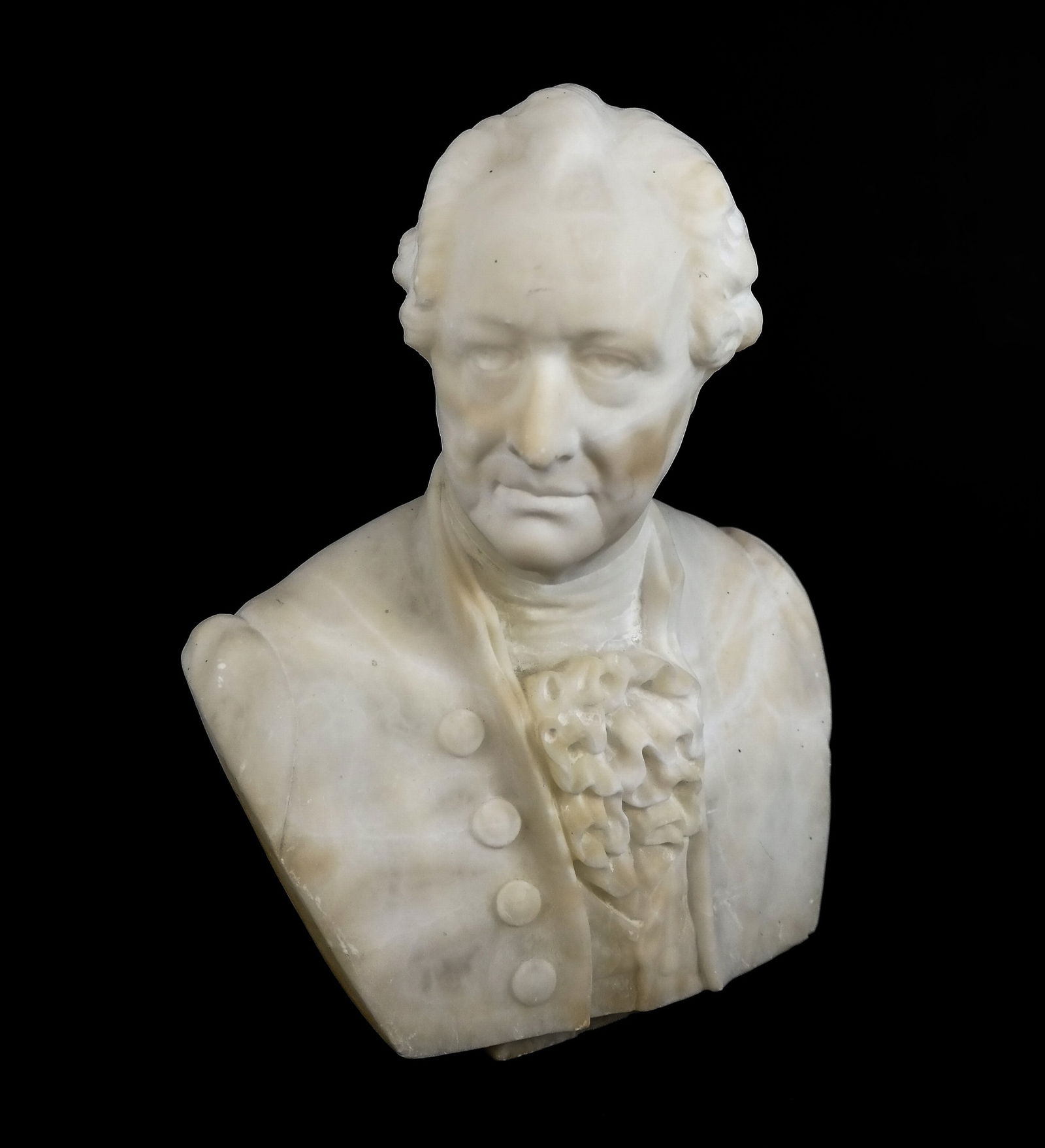 Carved Marble Bust of a Man: Carved marble bust of a man, 19th/20th century, unsigned. [11" H x 8.25" W x 4" D]. Condition is good with fleabites to base and drill hole to bottom.