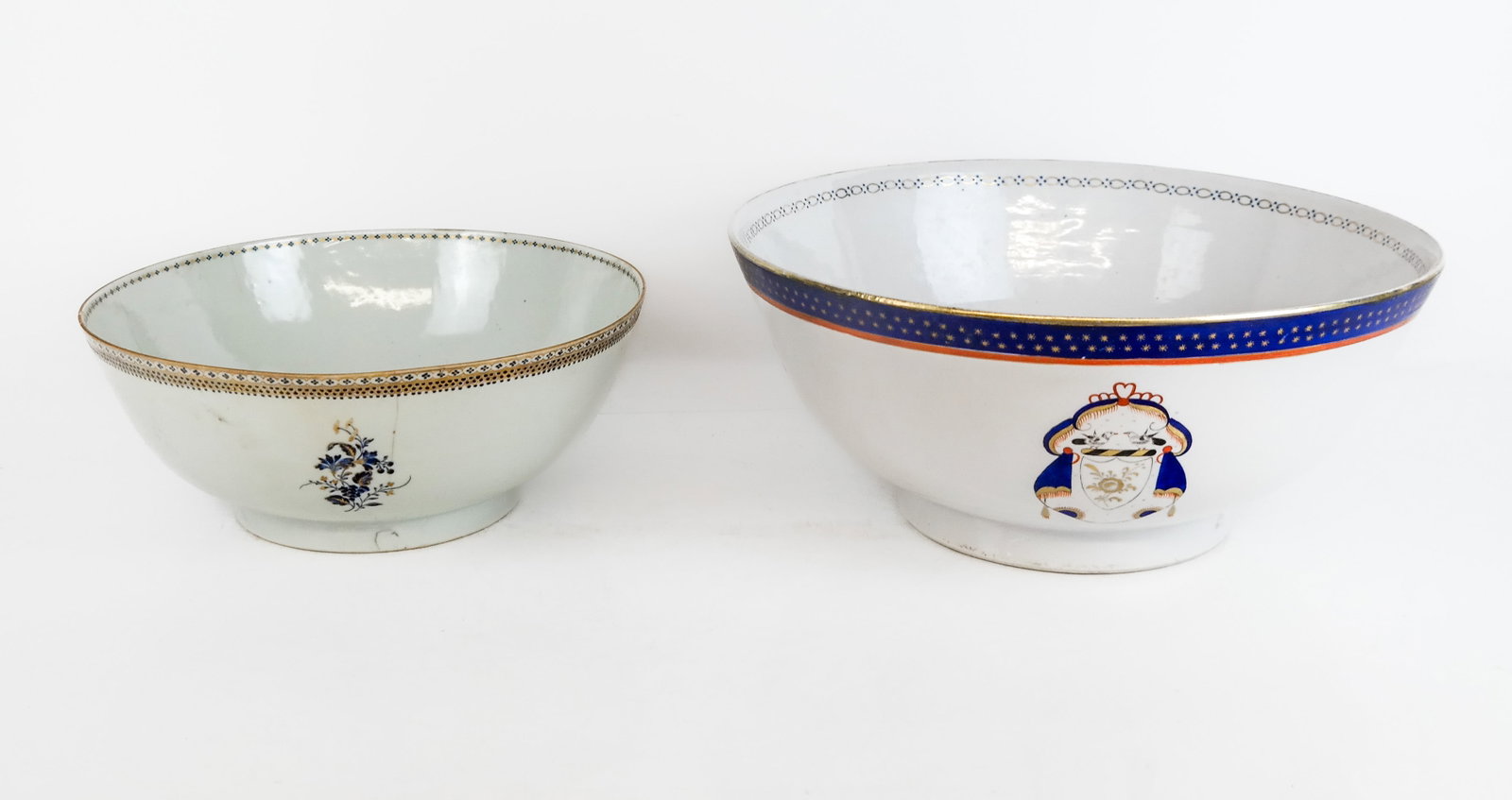 Two Chinese Porcelain Bowls: Two Chinese porcelain bowls, the smaller a Chinese Export bowl with blue and gilt small designs and trim [4.5" H x 11" Diameter], the larger in Armorial manner with blue and gilt designs, by Japanese 