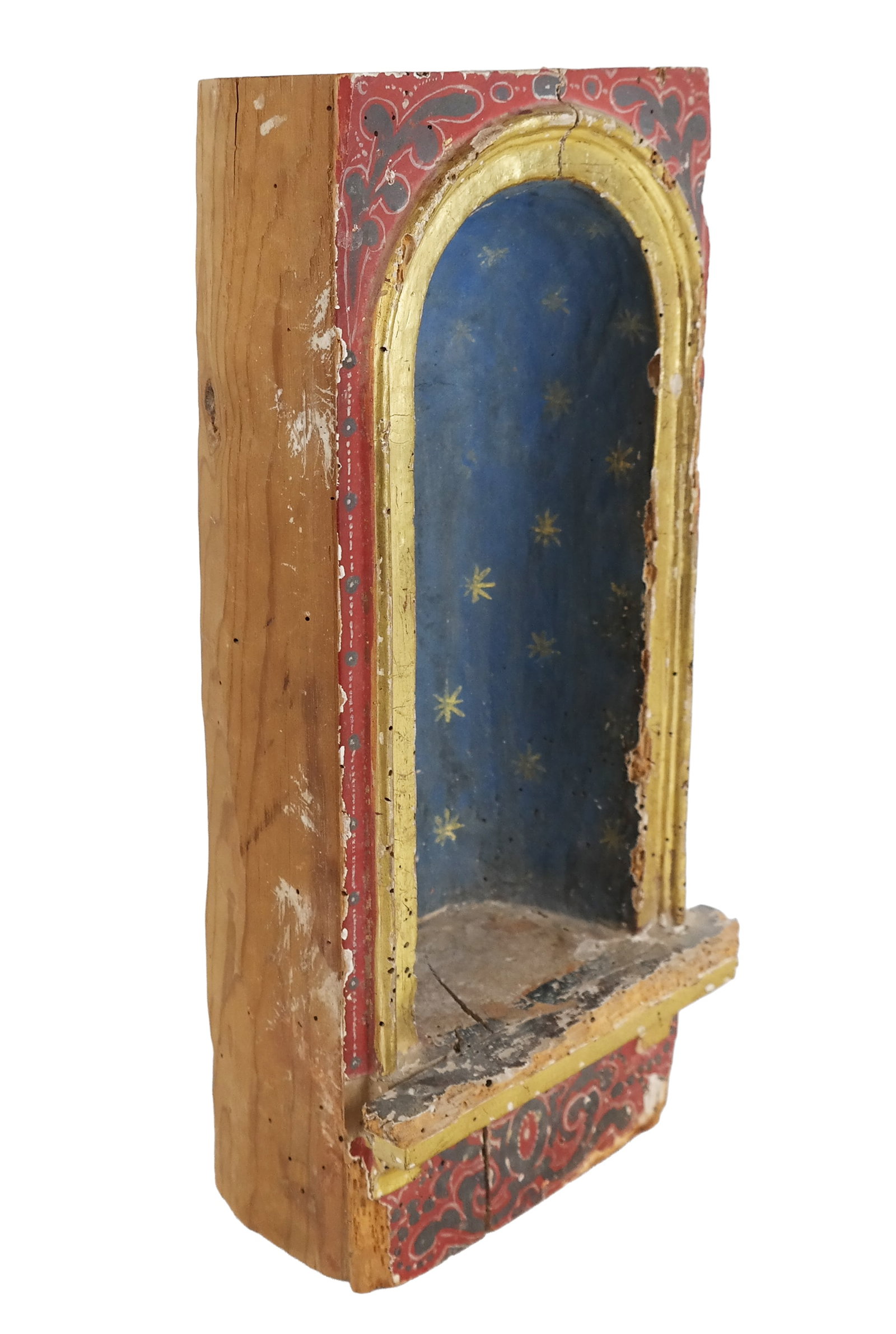 Carved, Gilt and Polychrome Reliquary: Carved, gilt, and polychrome wood reliquary, 20th century, hand-carved from a single log, with a gilt frame before a blue and star decorated interior, over a polychrome decorated lower. [15" H x 7" W 