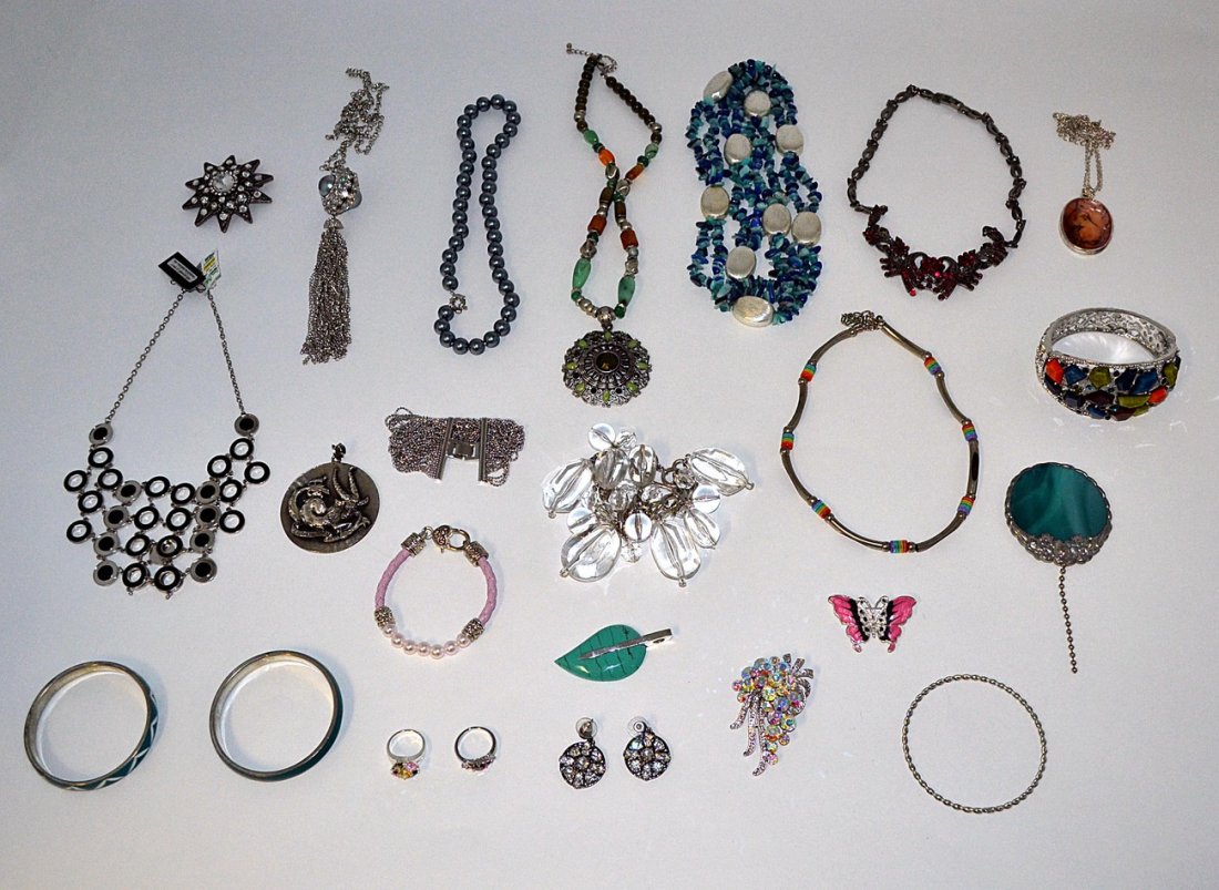 Assorted International Costume Jewelry: Contains North American, Asian, and European articles. Comprises: necklaces, bangles, bracelets, pins, pendants, rings, and others. Includes: hardstones, glass beaded, clear and colored paste stones,