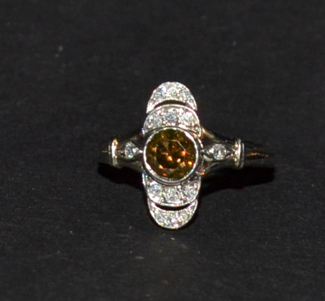 White Gold, Brown & White Diamond Ladies Ring: White gold, brown and white diamond ladies ring. 1 Round Old European cut diamond weighs approximately 0.50ct Deep brownish orange color; VS-1/VS-2 clarity bezel set 14 Round single cut diamonds weigh