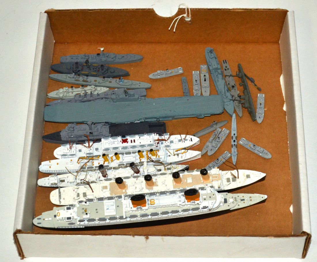 Collection of 25 Die-Cast Metal Ship Models: Water-line models comprising: air craft carrier, battle ships, attack boats, and ocean liner cruise ships ["Republic," "Victoria Luise," "Champania," "Olympic," and "Europa." Includes British and Germ