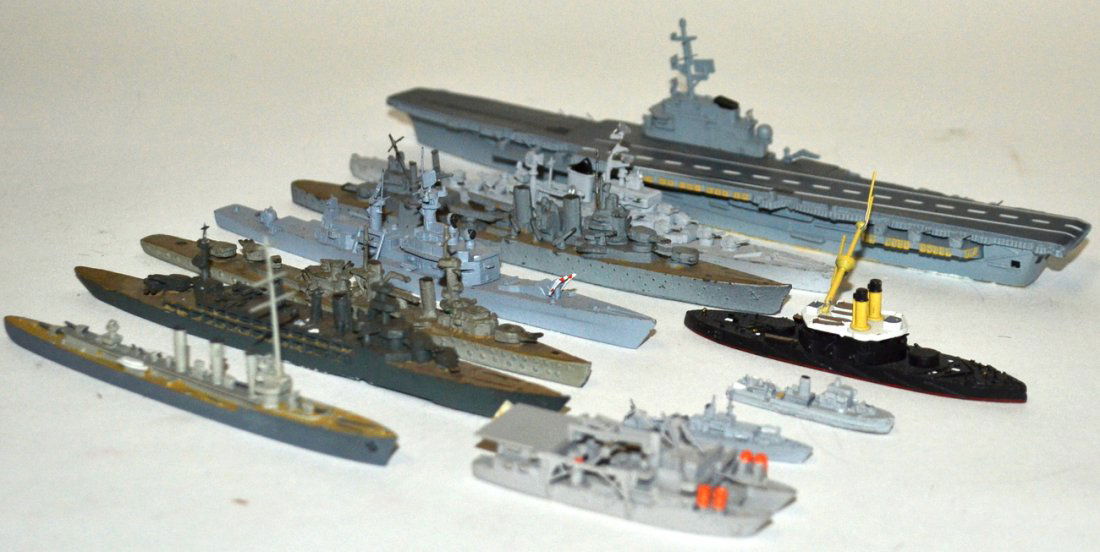 Collection of 25 Die-Cast Metal Ship Models: Water-line models comprising: aircraft carrier, battle ships, and others. Some British, German, and Austrian manufactured. Designs span 20th C. As is.