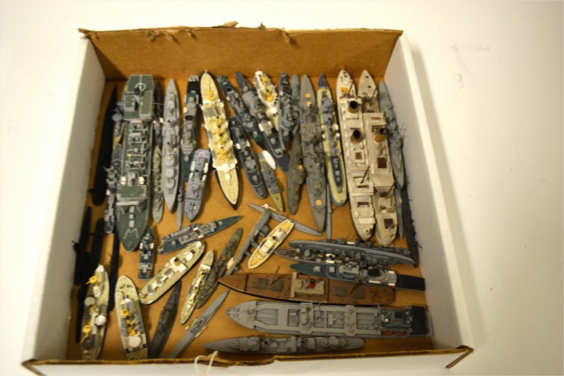 Collection of 40+ Wooden Ship Models: Hand-crafted Water-line models comprising warships, commercial ships, and ocean liners. Most British made. Designs span 20th C. As is.