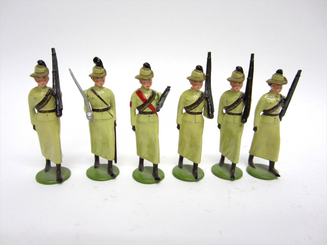 Set of Six Edwardian Female Soldiers: Comprises an officer with sabre and five rifle women. All hand-painted. [Each rifle woman: 2 3/4" H]