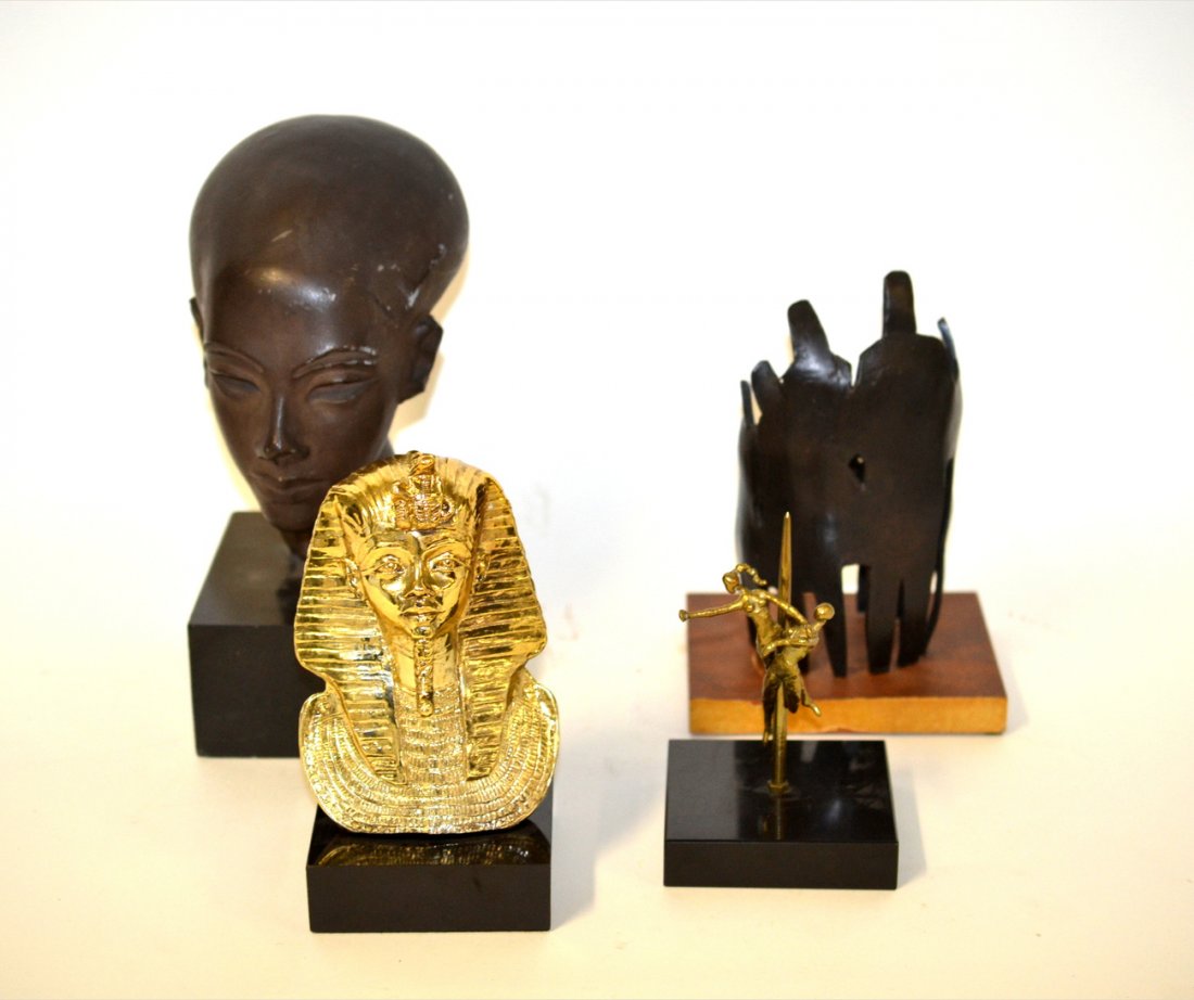 Assorted International Sculpture Lot: Comprises: 1) Gold-tone ancient Egyptian style bust of a pharaoh on mount. 8"H. 2) Patinated composition ancient Egyptian style bust of a woman on mount. 11 1/4"H. 3) Modern bronze sculpture of abstra